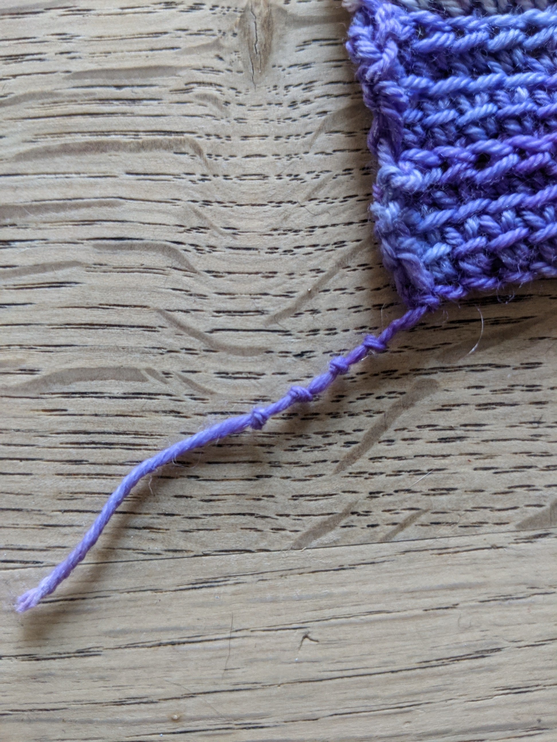 knotted yarn tail to record hook sized used