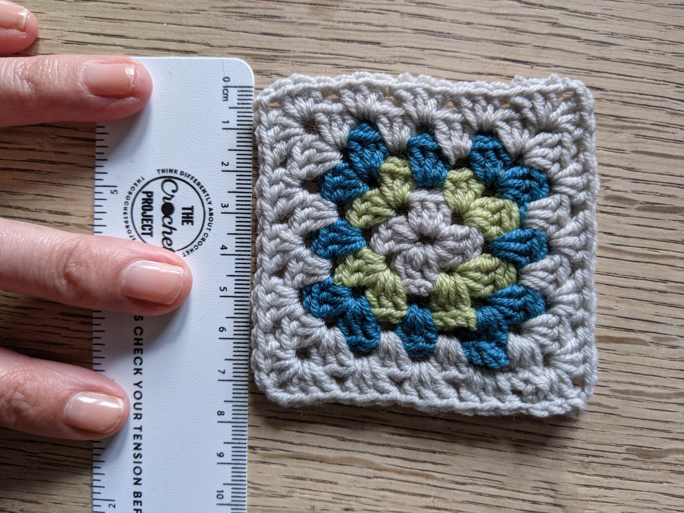 ruler and a crochet granny square